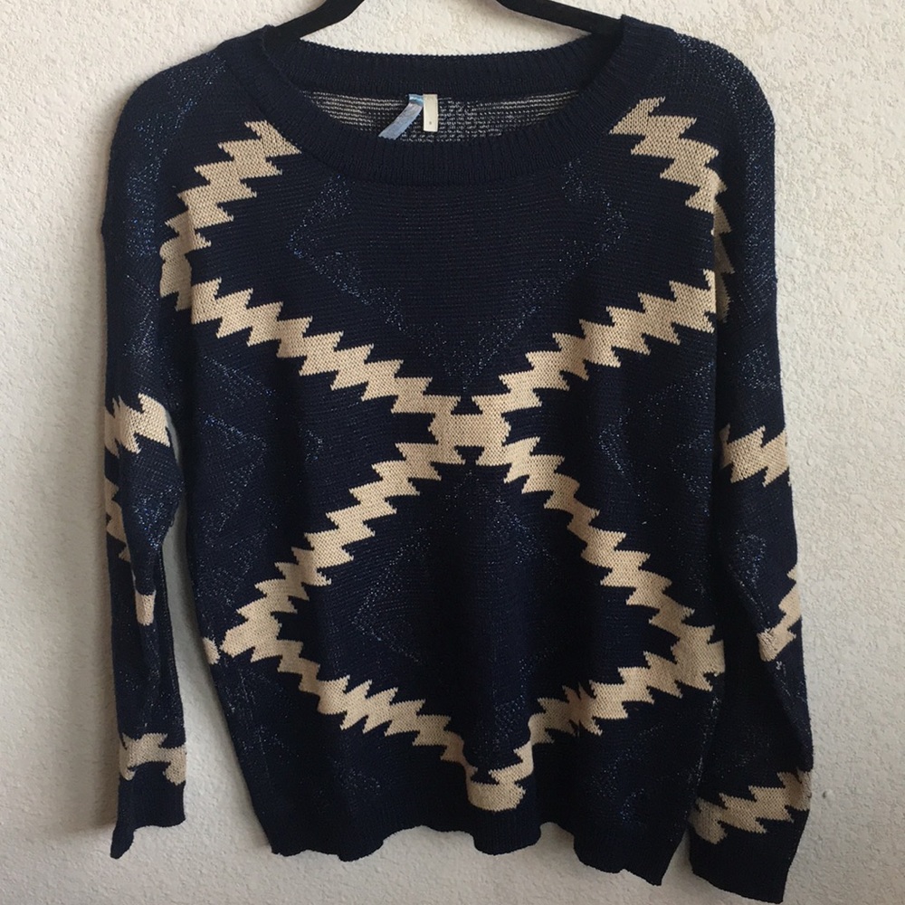 Navy blue sweater with tan pattern.